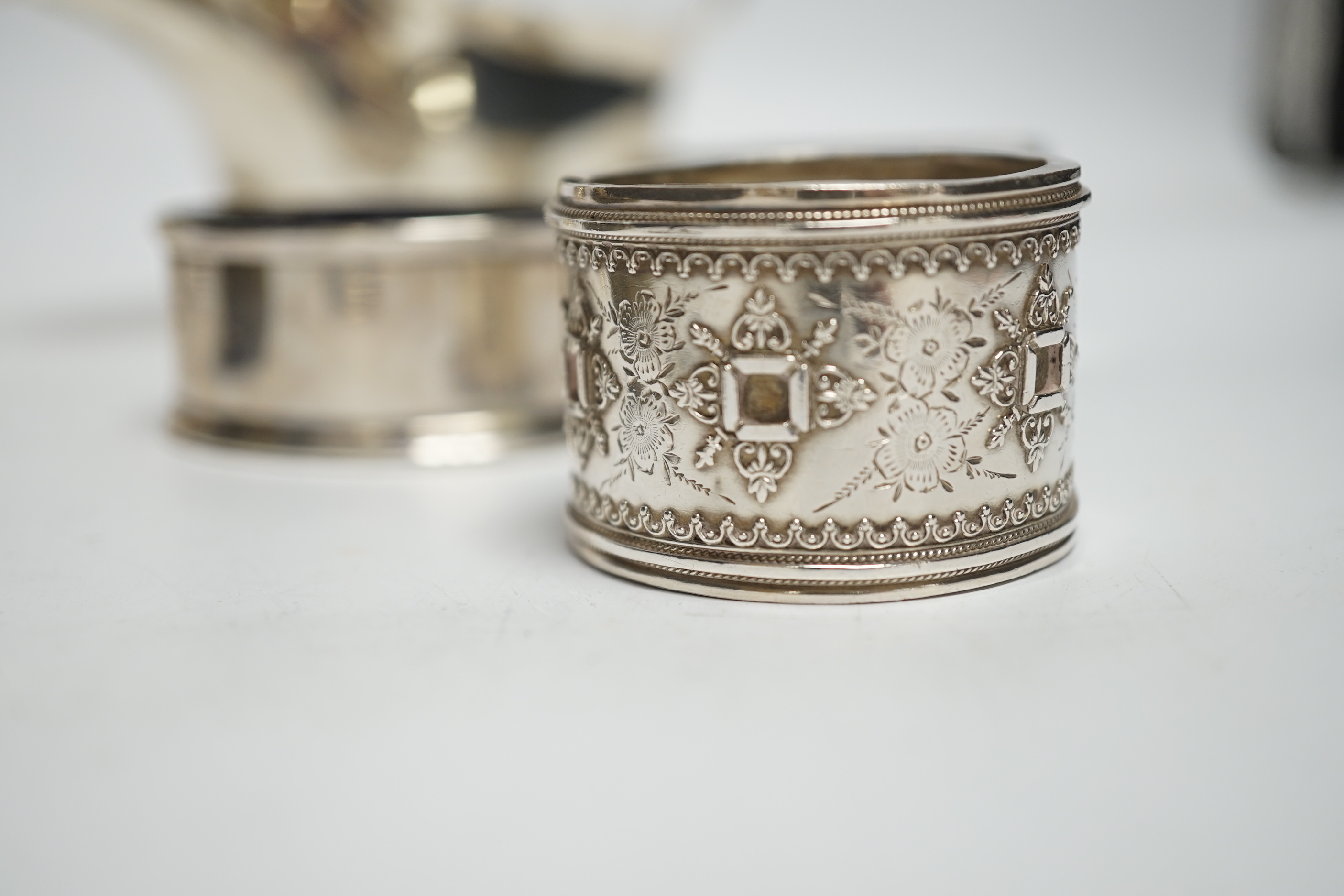 Sundry small silver including a silver sauceboat, George V sparrow beak cream jug, pair of pepperettes, napkin rings etc. and a letter opener/magnifying glass by Charles & George Asprey, London, 1908.